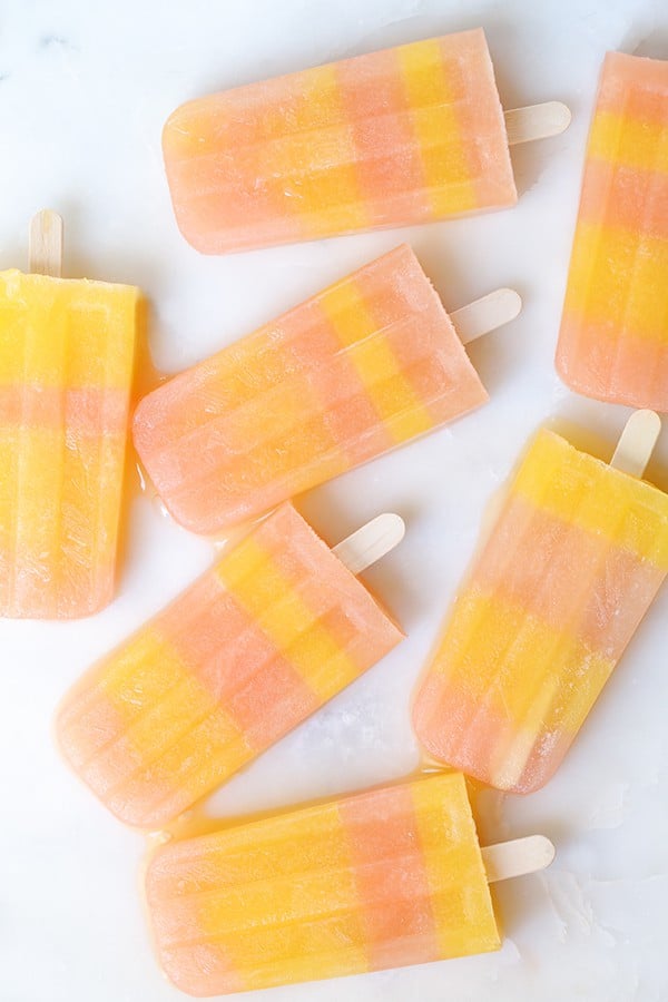 striped popsicles on a marble table