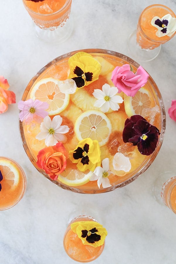 tropical pineapple party punch with edible flowers