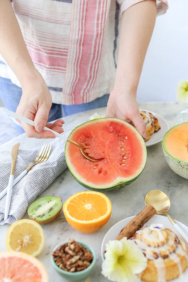 Scooping watermelon out with a spoon