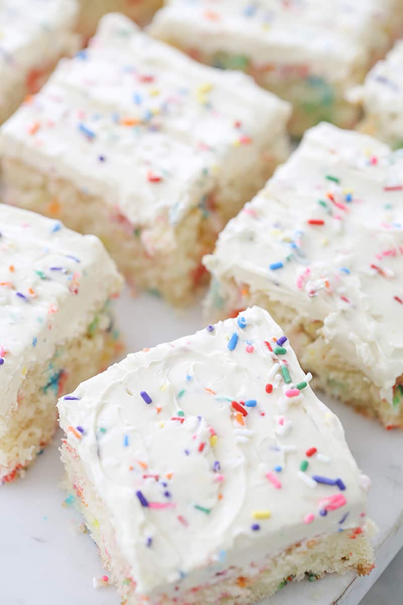 Fluffy white cake with colorful sprinkles. 