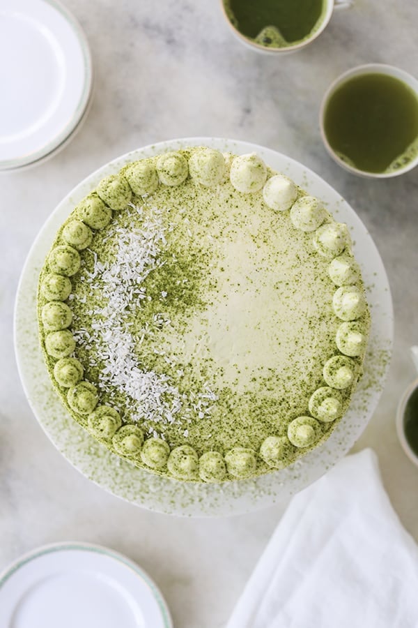 matcha cake with green frosting and coconut 