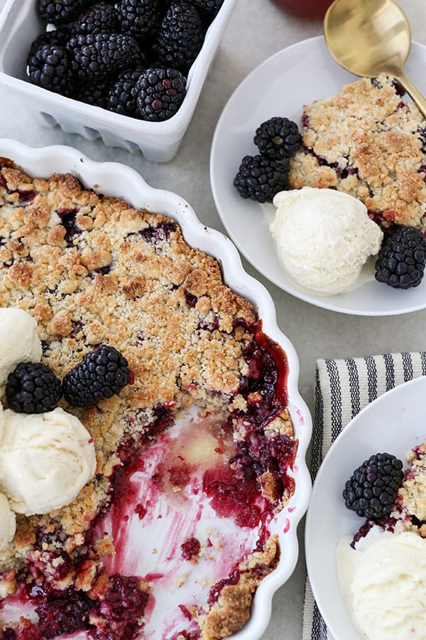 Blackberry cobbler crumble with vanilla ice cream and fresh blackberries 