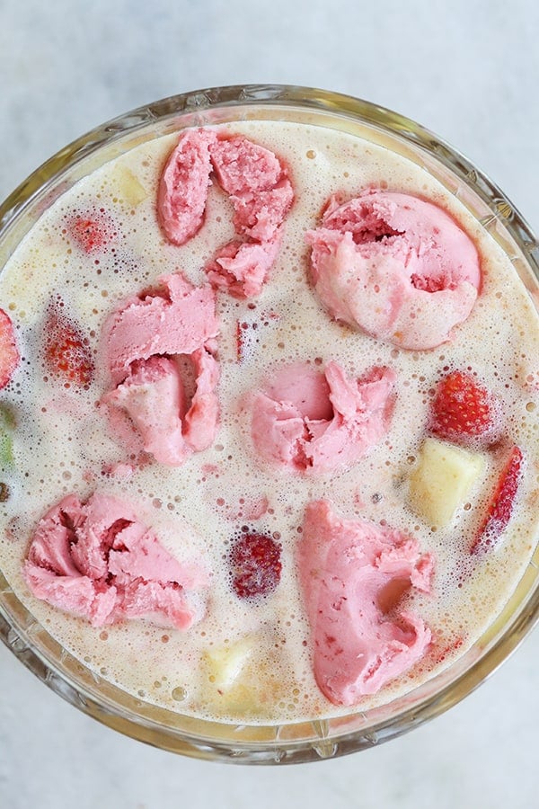 Sherbet punch with scoops of strawberry ice cream and fruit. 
