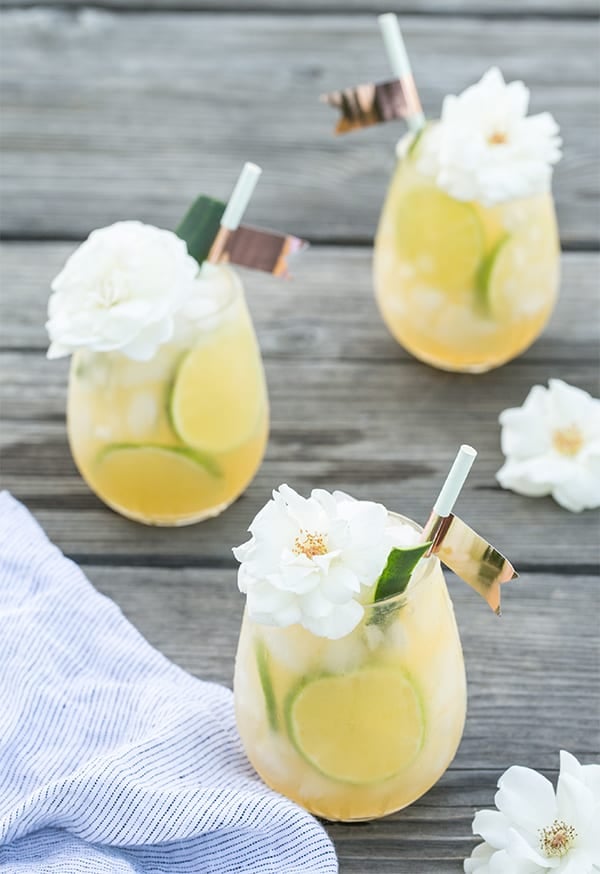 Three beautiful cocktails on a wooden table.