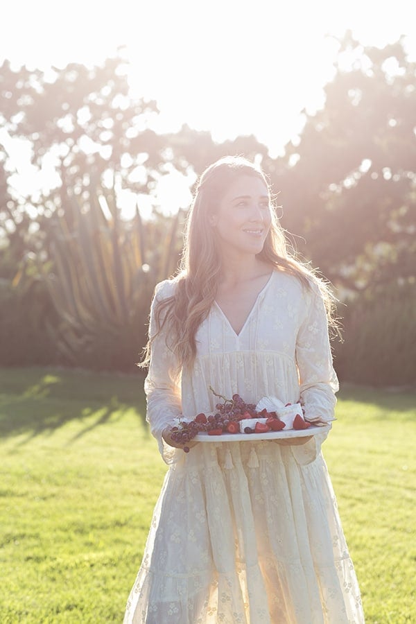 Eden Passante holding a cheese platter in Los Olivos. 