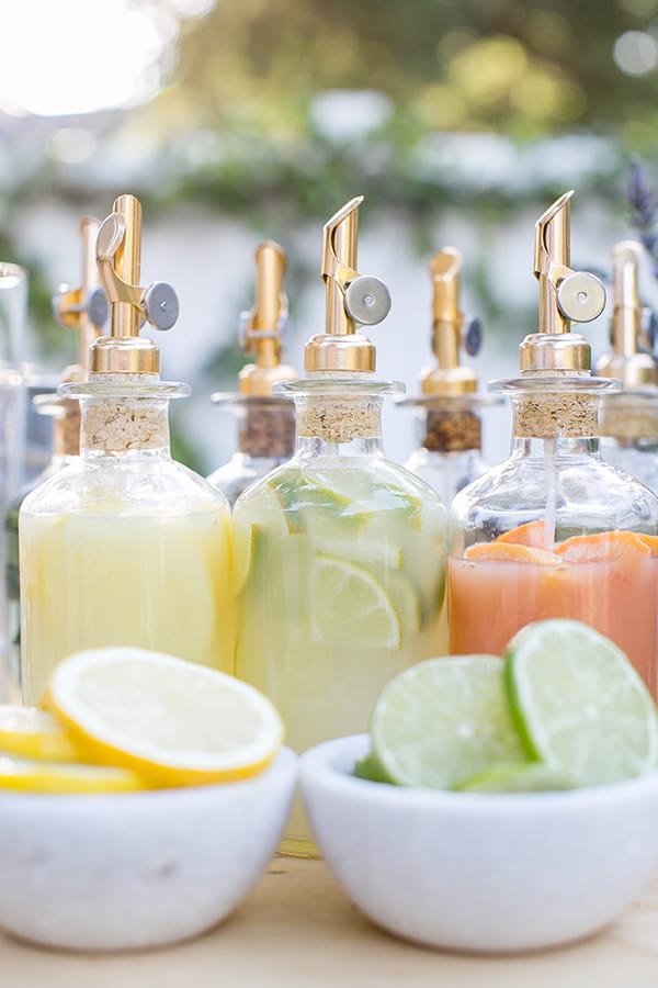 Fresh lemon juice, fresh lime juice and fresh juice in bottles.