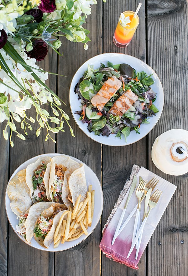 Fish tacos on a wooden table in Malibu.