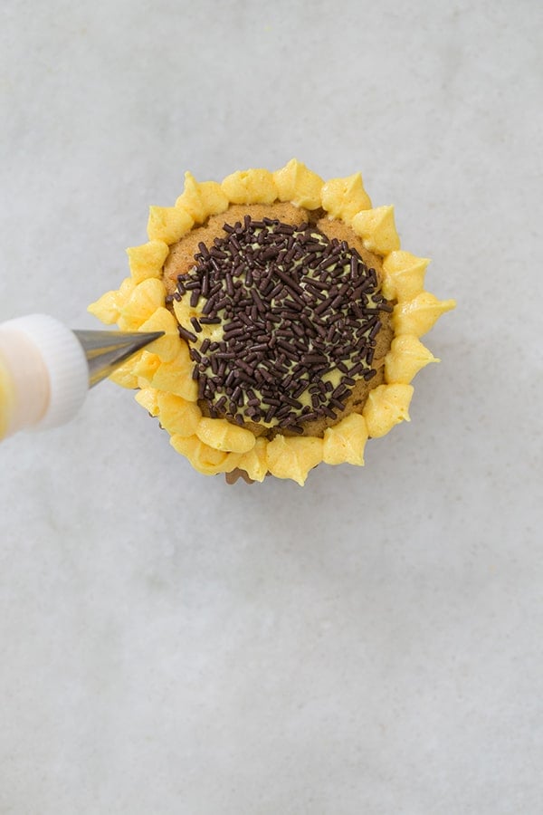 leaf frosting top adding yellow leaves to a sunflower cupcake