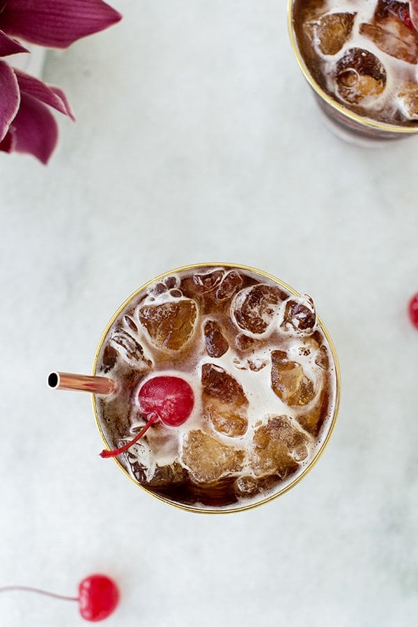 coffee tonic overhead with a red cherry on top.