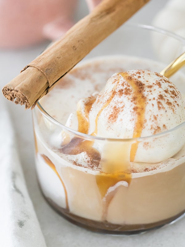 Ice cream with coffee poured over and a cinnamon stick.