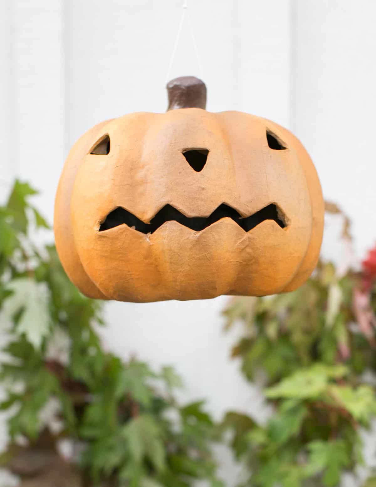 Glass Pumpkin Jack-o-Lanterns on Homemade Hay Bales