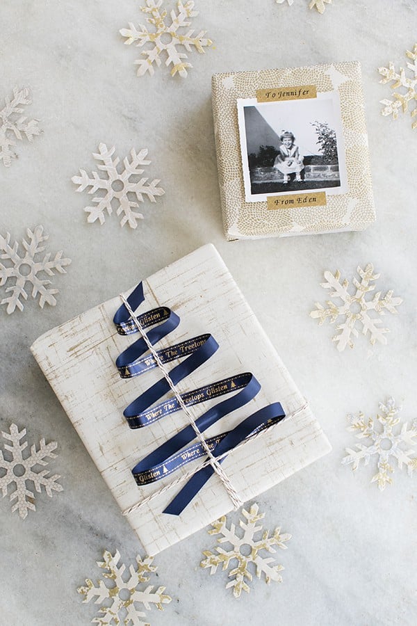 Gifts on a table with snow flakes. 