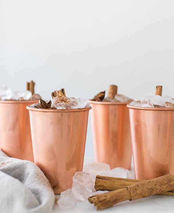 shot of copper mugs with finished drinks in them