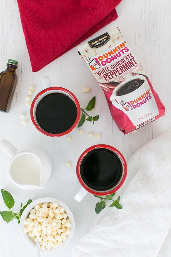 overhead shot of peppermint mocha on a table with Dunkin Donuts White