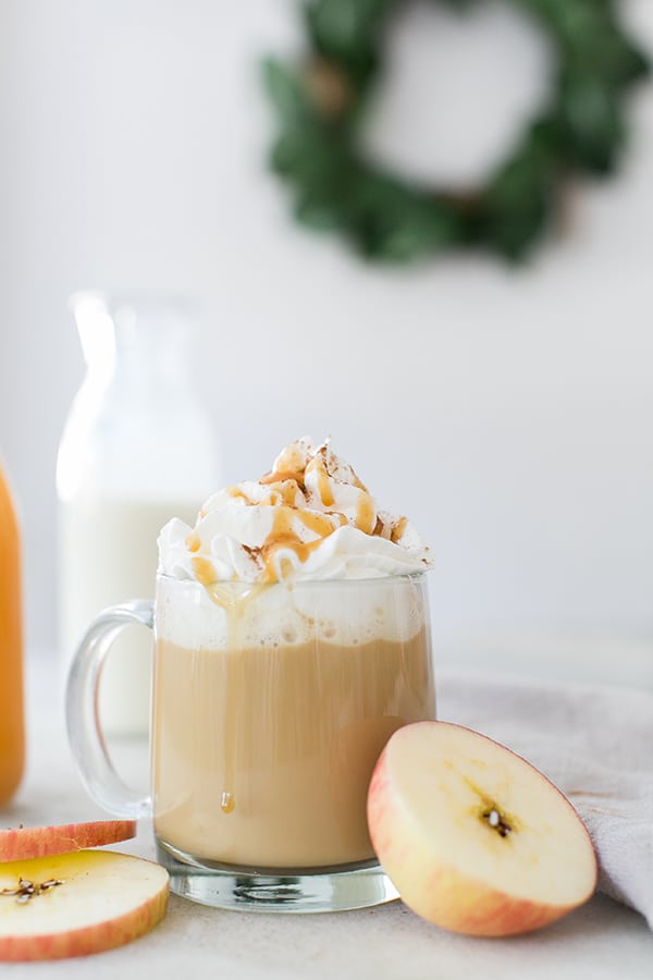 Apple pie coffee with whipped cream and drizzled with caramel and spices. 