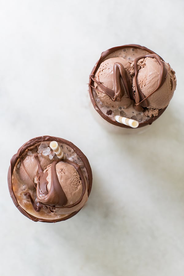 Cold brew coffee floats with chocolate ice cream and melted chocolate.