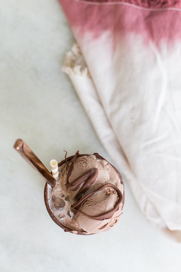 Cold brew coffee float with chocolate over the top.