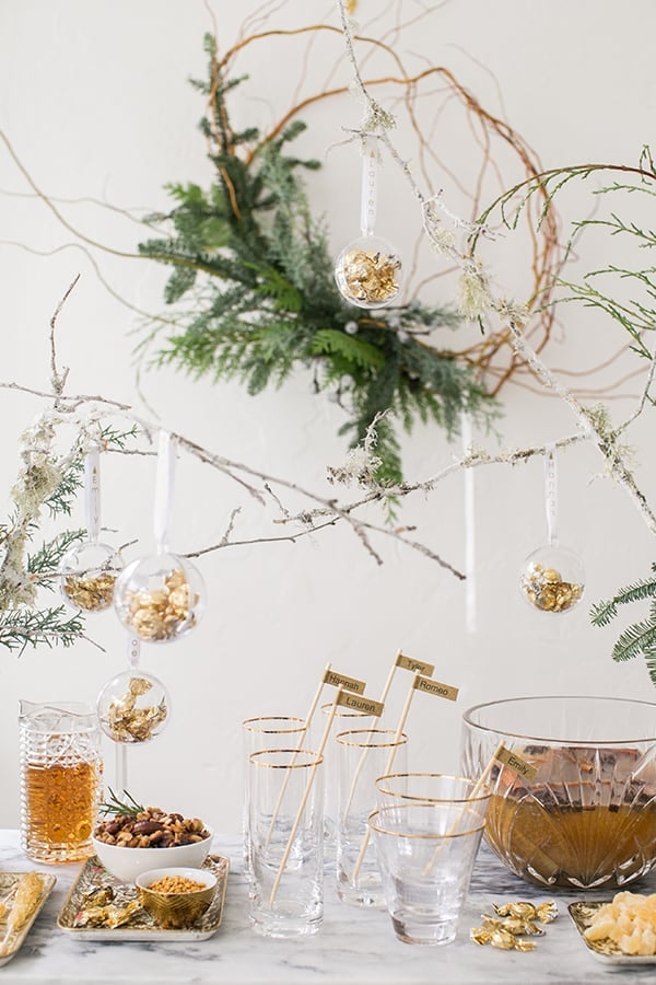 wide shot of drink station with punch bowl and snacks