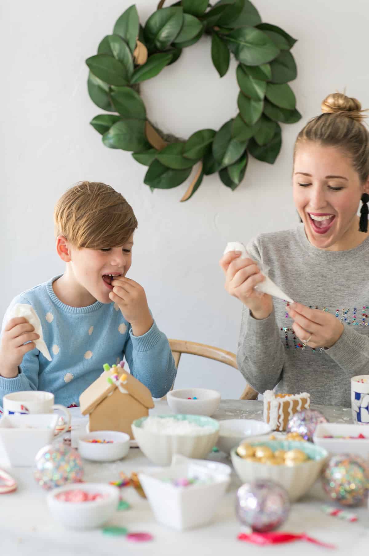 eden and romeo having fun at the diy gingerbread house party  - cute little gingerbread house, milk cartons