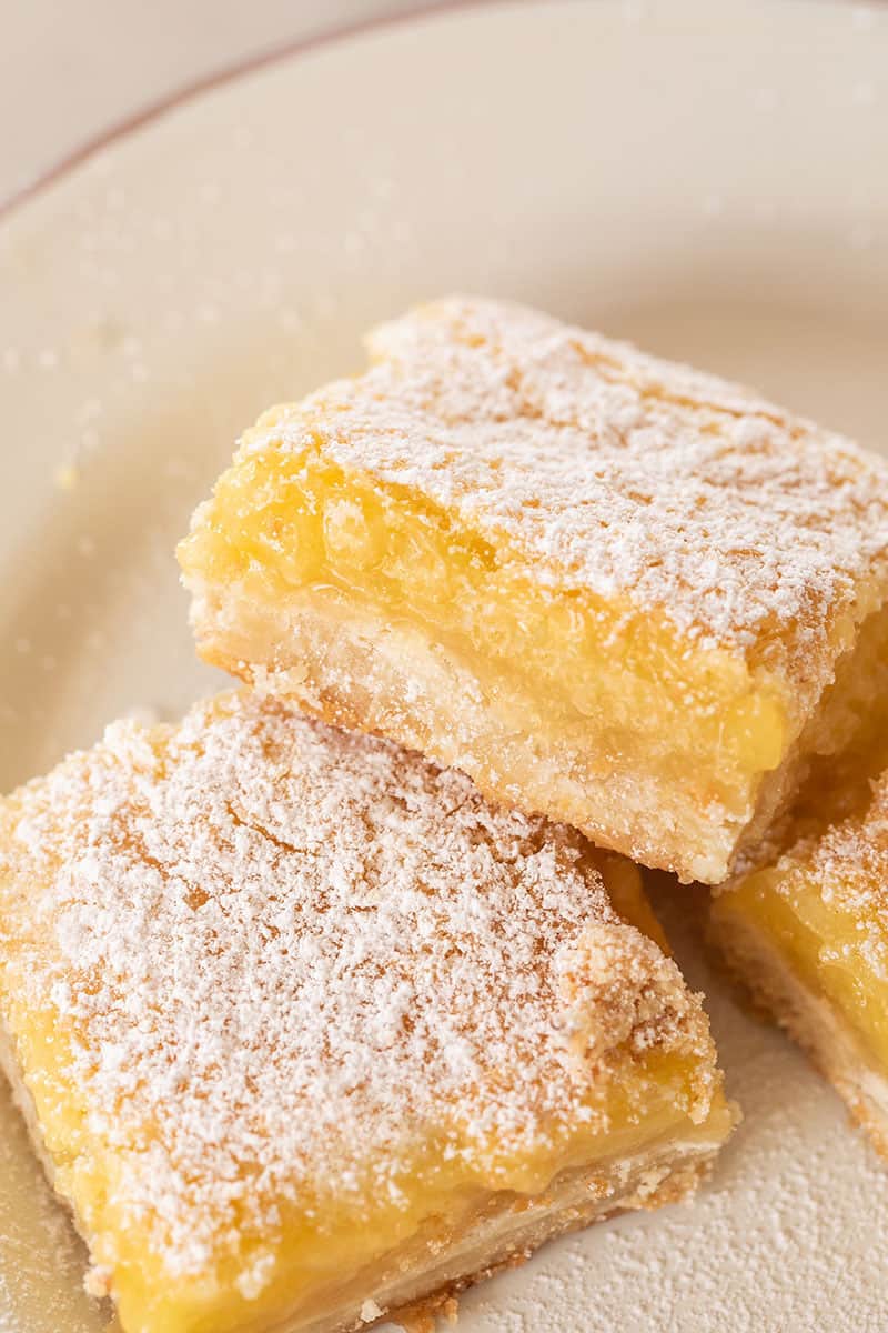 The yummiest lemon bars with powdered sugar.