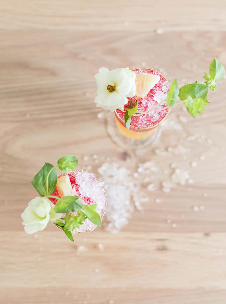 Pineapple tequila cocktail with flowers and pineapple 