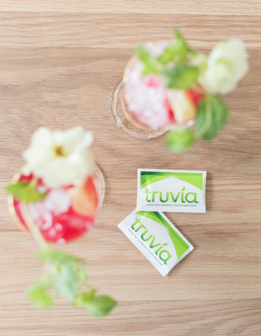 Truvia sweetener on a table with a pineapple cocktail 