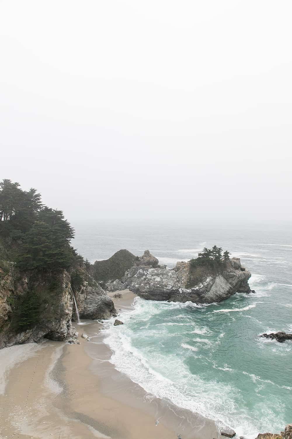 Stunning beach view with a waterfall 