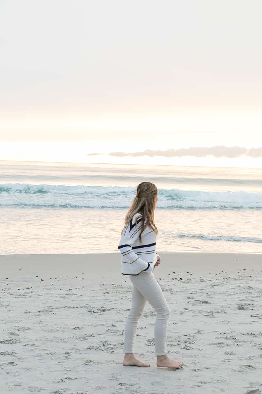 Eden Passante walking on the beach in Carmel 