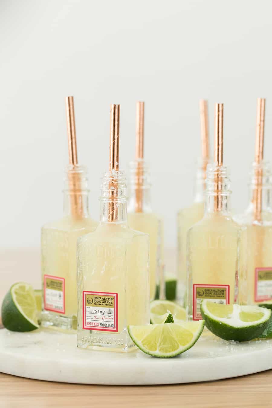 Mini margarita shot recipe in small tequila bottles.