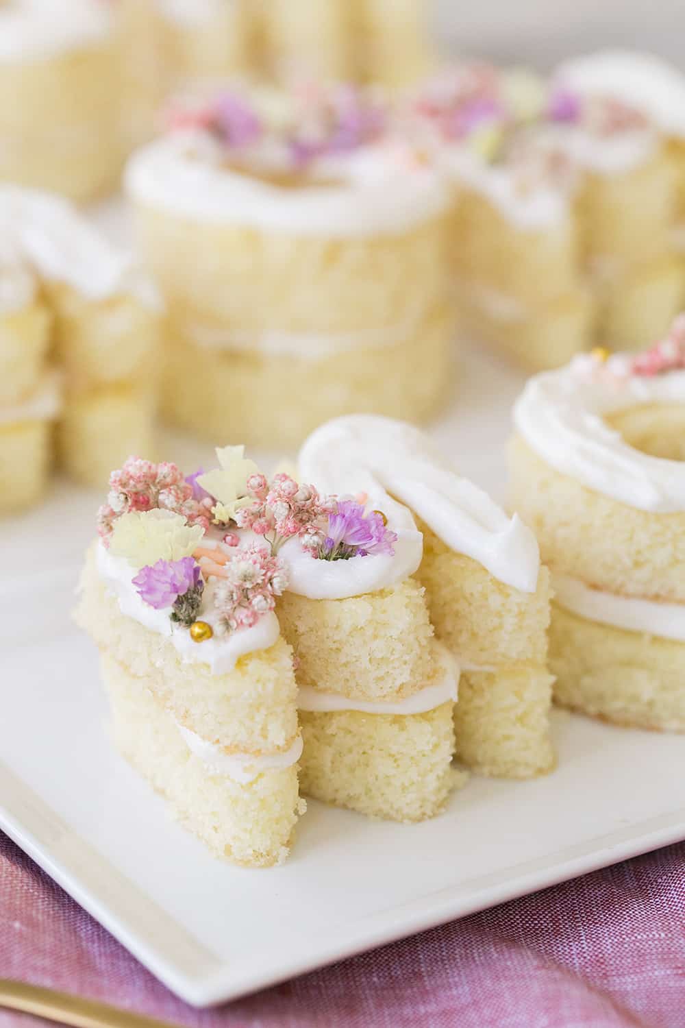 M cake with frosting and flowers 