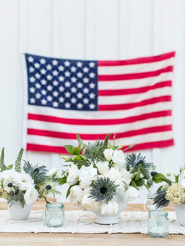 4th of July flowers in white vase.