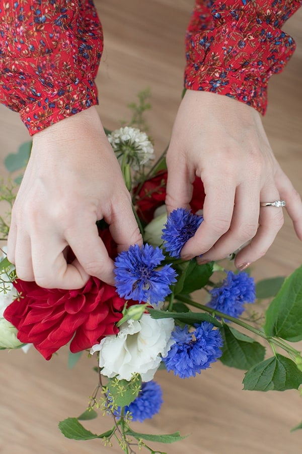 Eden Passante arranging flowers for the 4th of July.