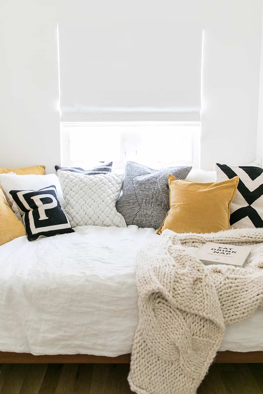 guest bedroom ideas to add throw pillows yellow and black on a guest bedroom.