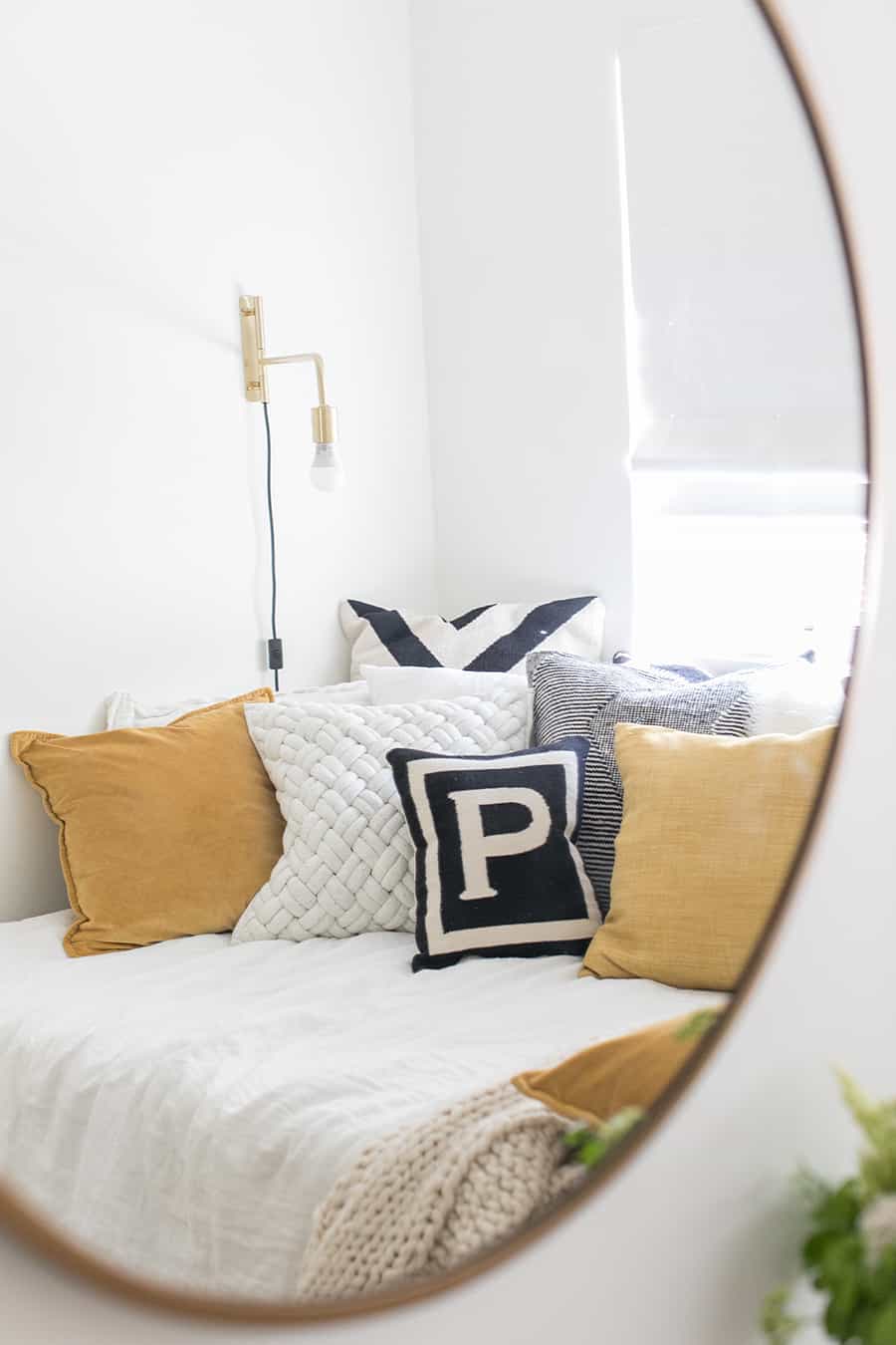 Photo in a mirror with pillows and gold light