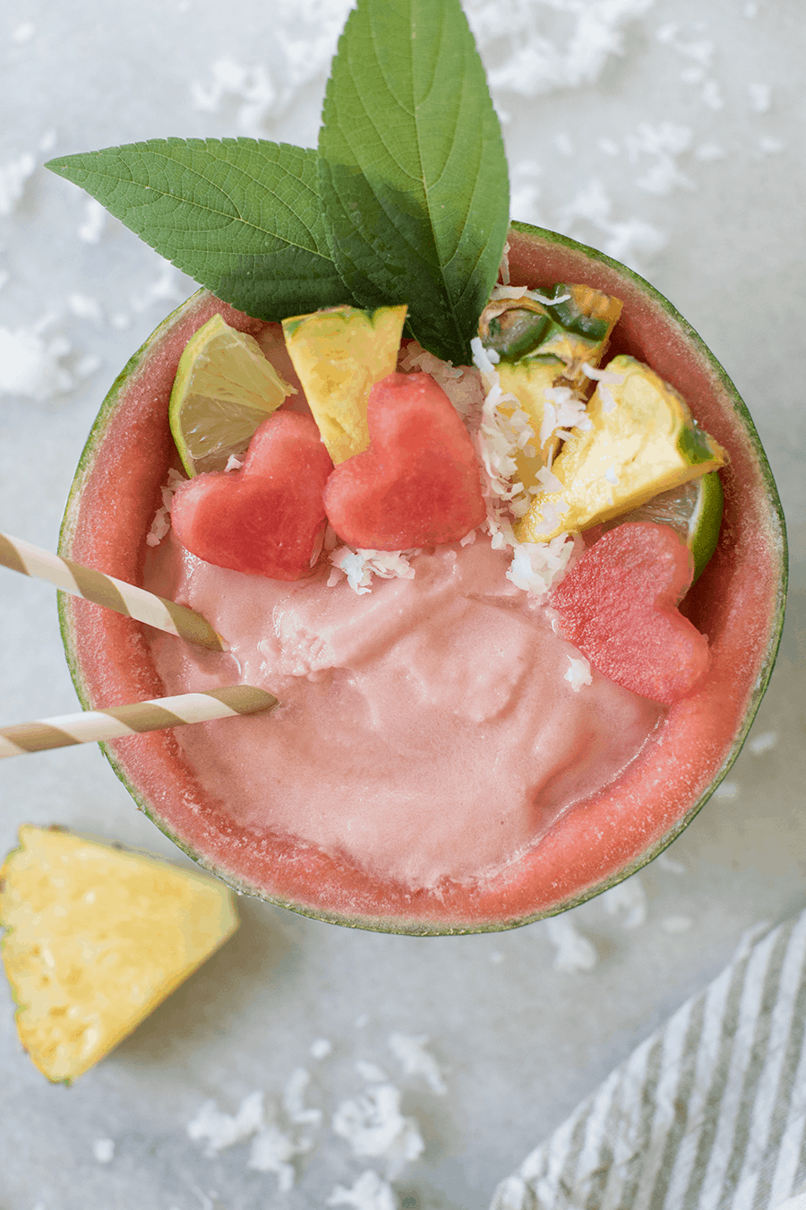 Watermelon pina colada in a watermelon bowl.