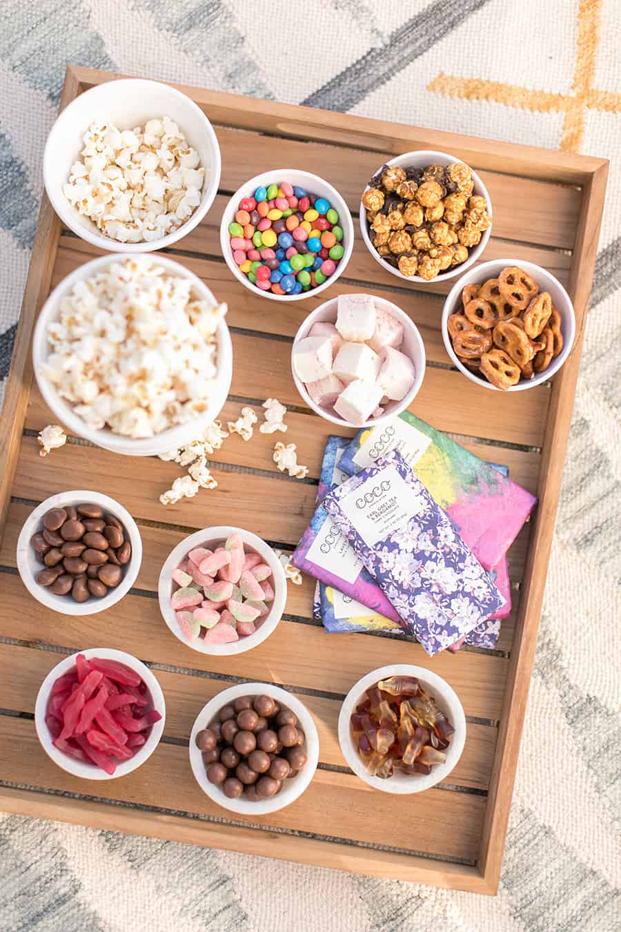 Overhead teak tray with bowls of candy.