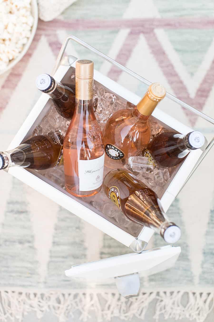 cooler filled with ice and bottles of rosé.