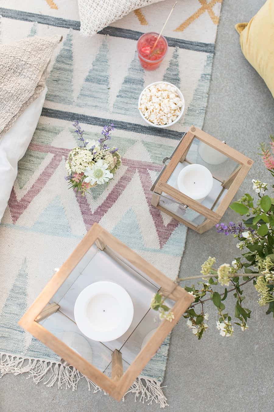 overhead of teak lights with flowers and popcorn.