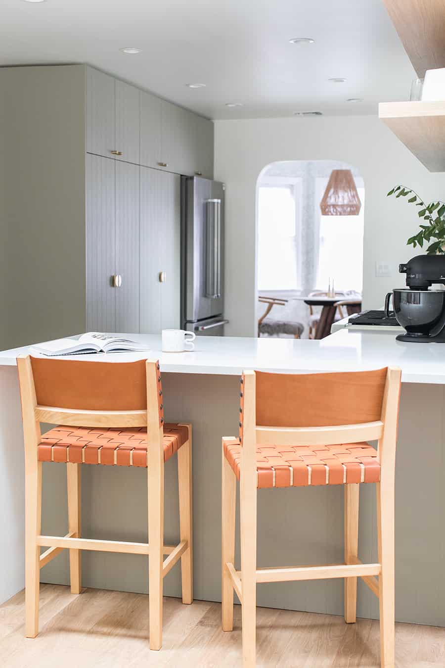 kitchen and dining room remodel with leather chairs.