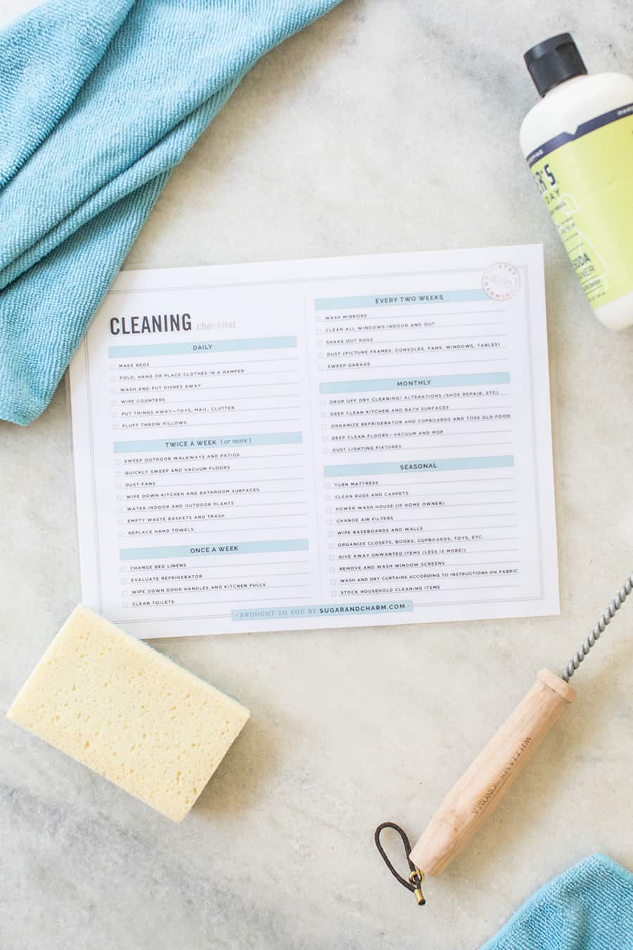 cleaning chart with sponge and towel on marble table