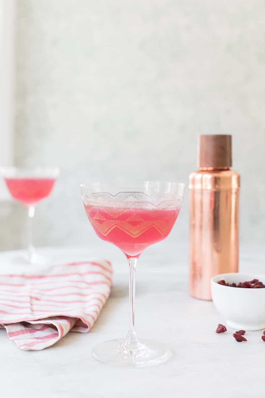 pink drink in a coupe glass.