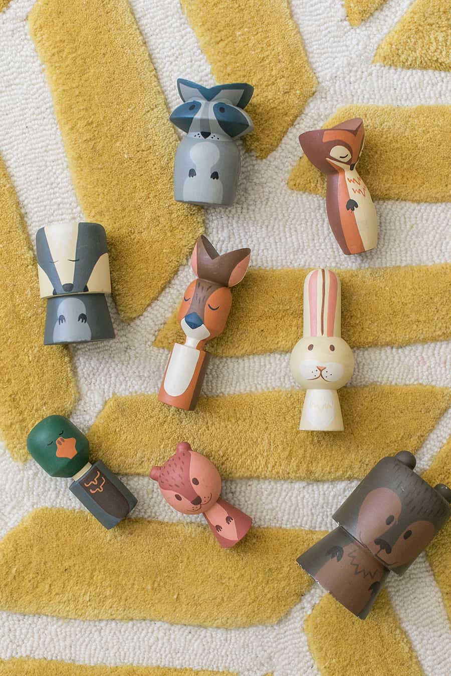 Wooden critters on a yellow rug