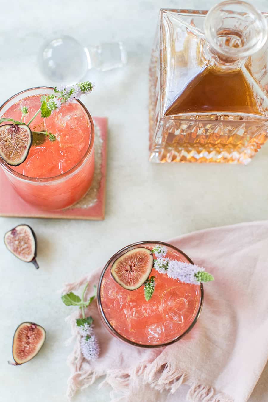 Sidecar cocktail overhead with  edible flowers and cognac. 