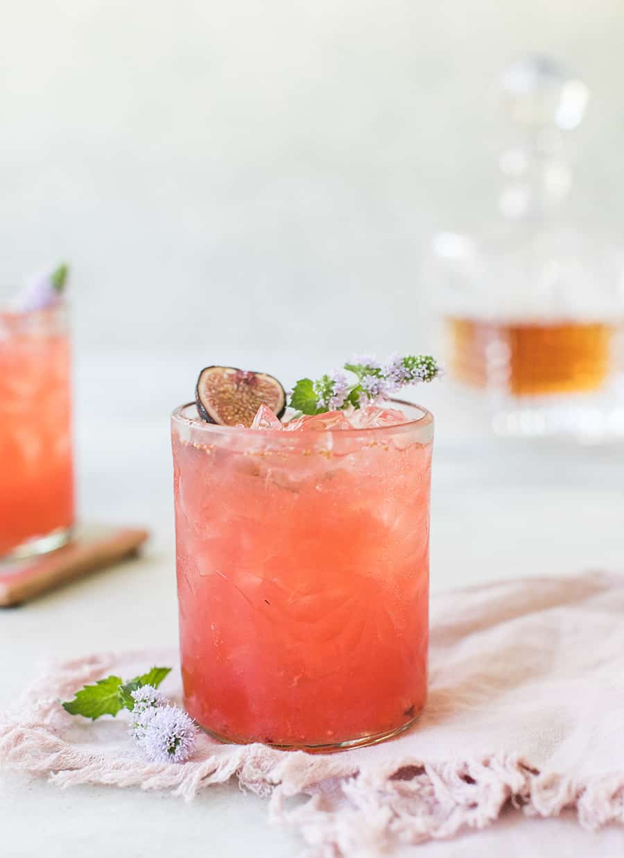 Sidecar in a glass on a marble table.