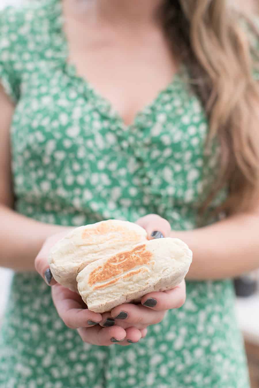 Girl holding homemade Irish soda bread.