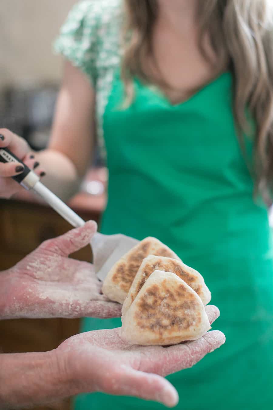 Holding Irish soda bread in hand.