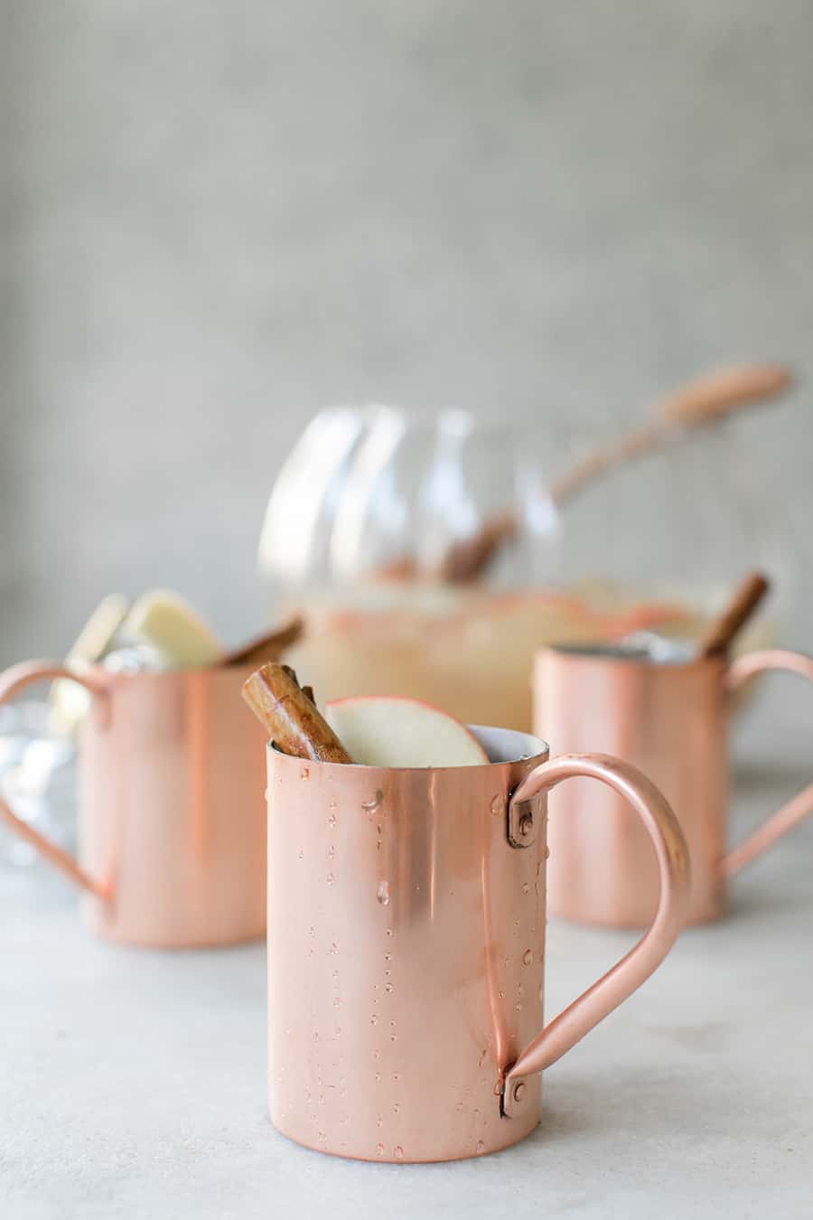 side shot of copper mugs