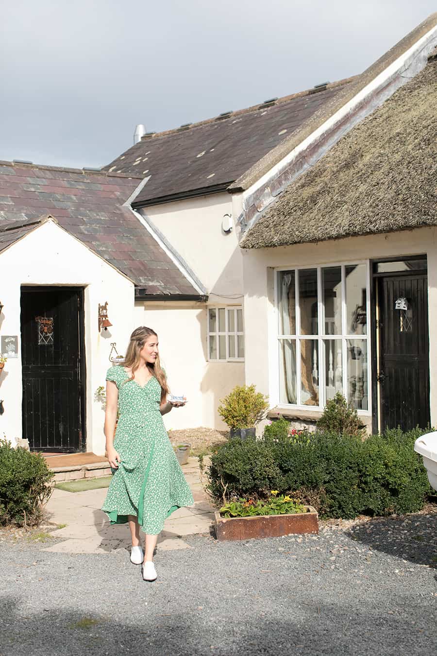 Eden Passante in front of a cottage in Northern Ireland.