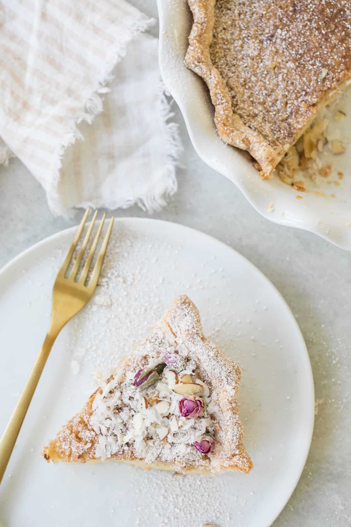 slice of pie on a white plate with a gold fork - unbaked pie crust