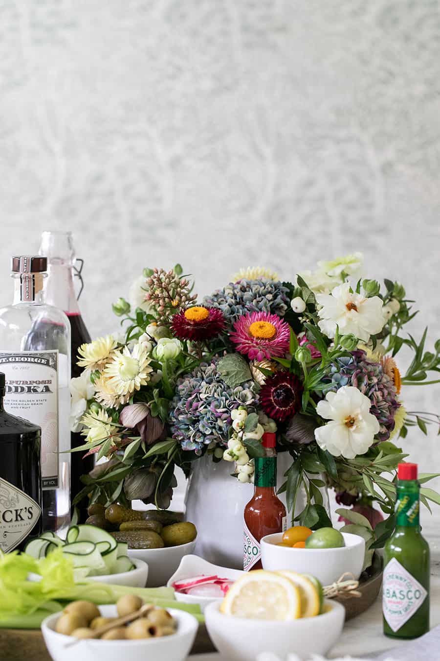 Flowers and ingredients for a bloody Mary bar.